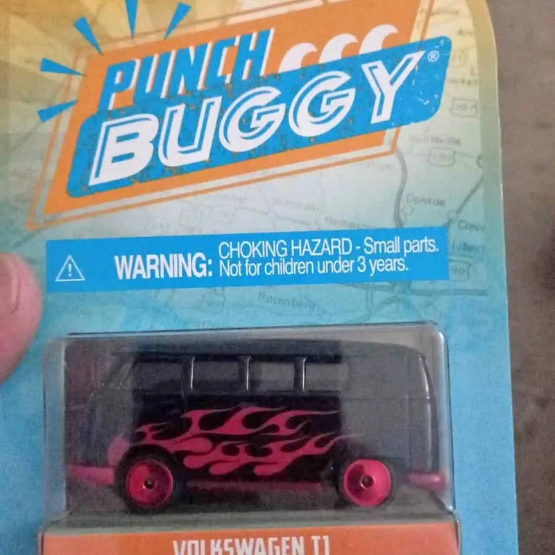 Diecast toy Volkswagen T1 bus with pink flame graphics, in blue blister package