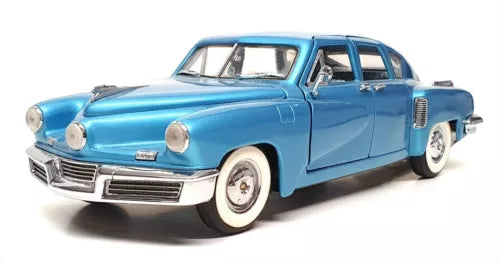 Blue 1948 Tucker diecast car model with chrome grille and whitewall tires
