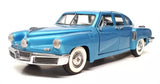 Blue 1948 Tucker diecast car model with chrome grille and whitewall tires