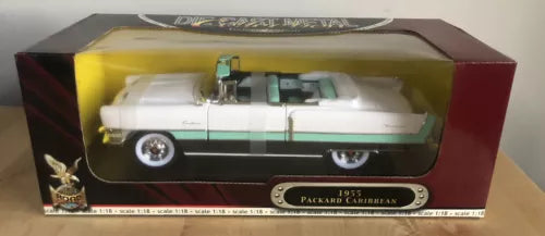White and green 1955 Packard Caribbean diecast toy car in display box