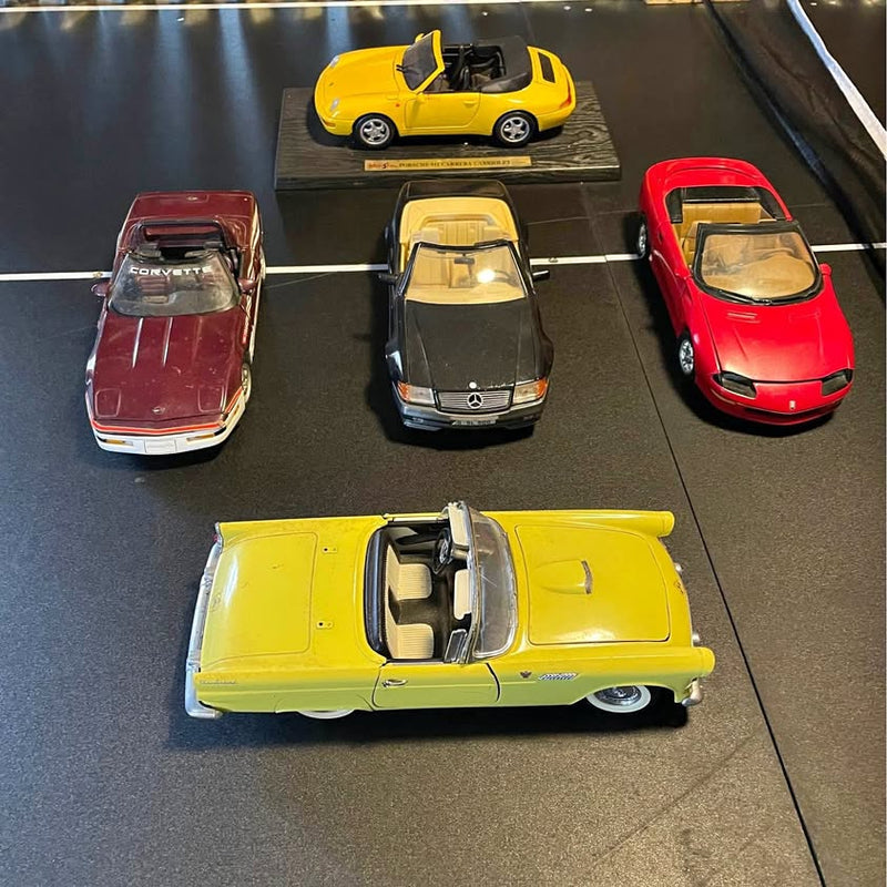Set of four 1/18 diecast cars: maroon, red, black, and yellow models