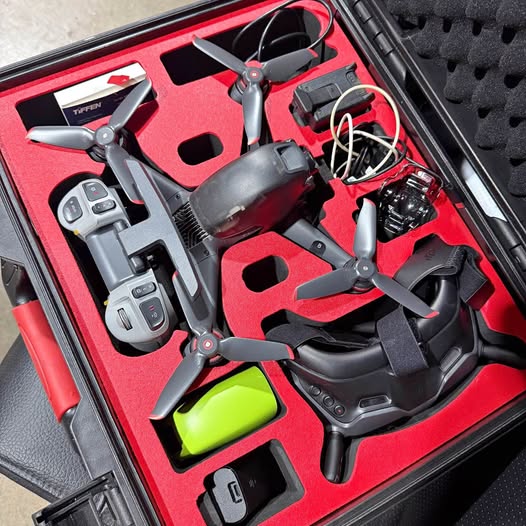 DJI FPV drone kit with controller and headset accessories in red case