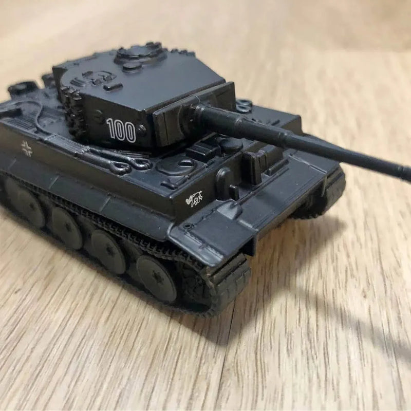 Black diecast tank model with turret and long cannon