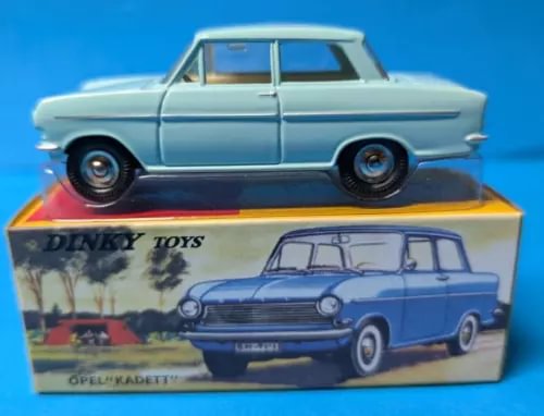 Light blue vintage diecast sedan model car with black wheels