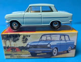 Light blue vintage diecast sedan model car with black wheels