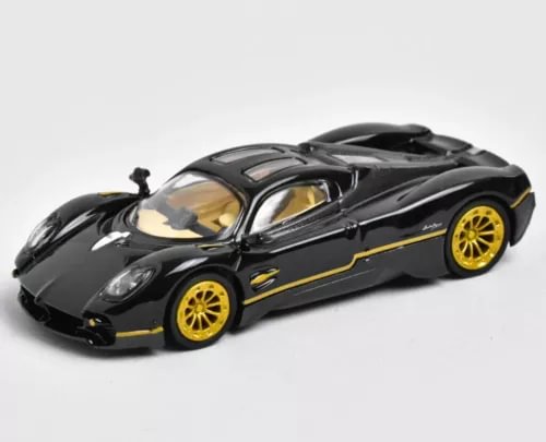 Black diecast sports racing model car with gold wheels, front three-quarter view.