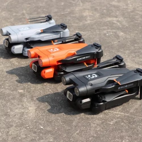 Quadcopter drone set with 4K camera, showing gray, orange, and black models