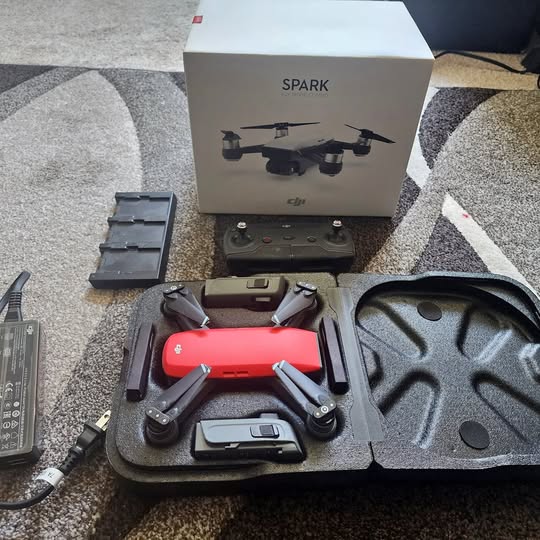 DJI Spark drone kit with controller, batteries, and carrying case