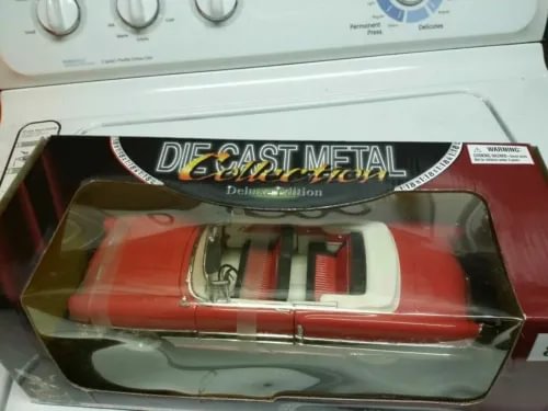 Die-cast car model in box, red and white with black window trim