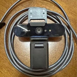 Logitech Brio 4K webcam with black housing and attached cable
