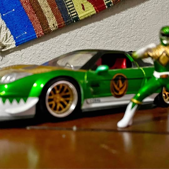 Jada Toys 1:24 diecast green Honda NEX car with matching action figure