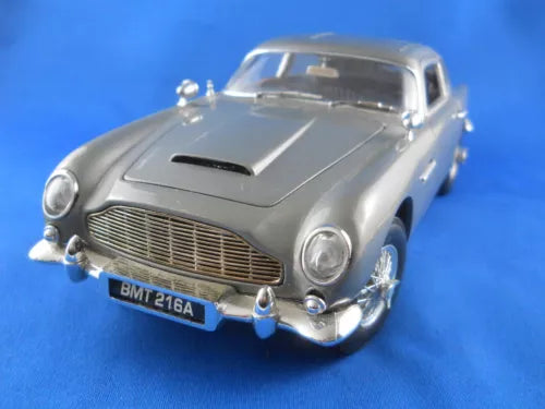 1:18 diecast classic car, metallic gray front with chrome grille and headlights