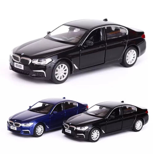 Diecast model car of a black BMW M550i sedan with detailed grille, headlights, and silver wheels.