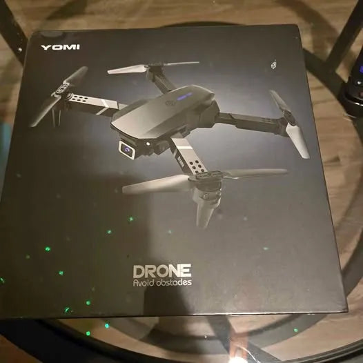 Unopened drone box with YOTMI branding and quadcopter illustration