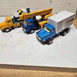 Vintage diecast truck set of three with blue, yellow, and box trucks