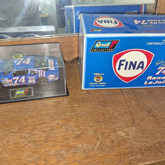 Collectible diecast car with box, blue and white No. 74 racing design
