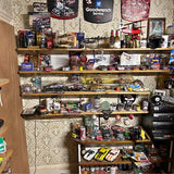 Assorted NASCAR racing diecast cars and collectibles displayed on store shelves