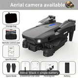Gray and black camera drone with front light and foldable propellers, single battery