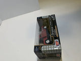 Red diecast pickup truck model in retail box with window display