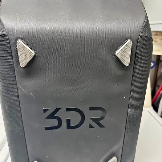 3DR drone case with dark textured surface and triangular side panels, with 3DR logo