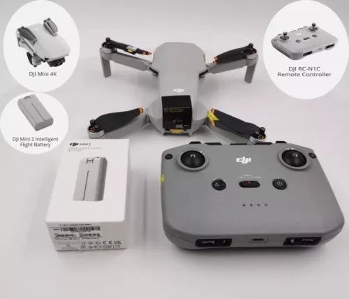 Compact white quadcopter drone with 3-axis gimbal and controller, folded propellers