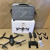 Foldable drone kit with carrying case, propellers, and remote controller