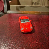 Red Porsche 911 diecast model car, front view