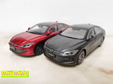 Diecast metal model cars, red and gray sedans with detailed front grilles