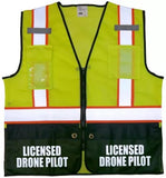 High-visibility reflective vest, yellow with black hem, zip front, 'LICENSED DRONE PILOT' on chest