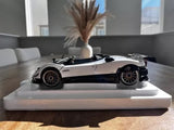 White open-top diecast model car with black wheels and front grille details