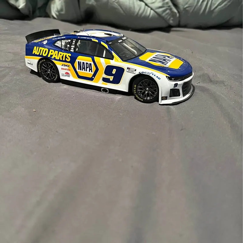 Diecast race car model in blue and white with NAPA #9, black wheels