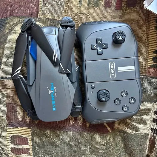 Gray drone remote controller with buttons, joystick, and DRONE logo