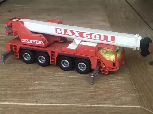 Red diecast mobile crane truck with MAX GOLL lettering and extendable boom, 1:55 scale