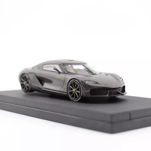 Diecast sports car model in dark gray/black with yellow wheels, front view