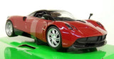Red and black 1:24 scale diecast sports car model with silver wheels
