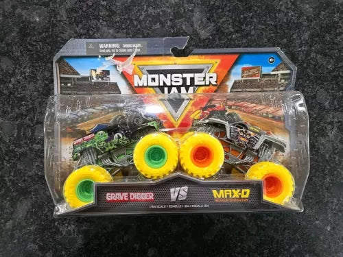 Monster Jam Grave Digger vs MAX-D diecast monster truck set in clear blister pack
