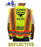 High-visibility safety vest, neon green with orange reflective stripes and front print