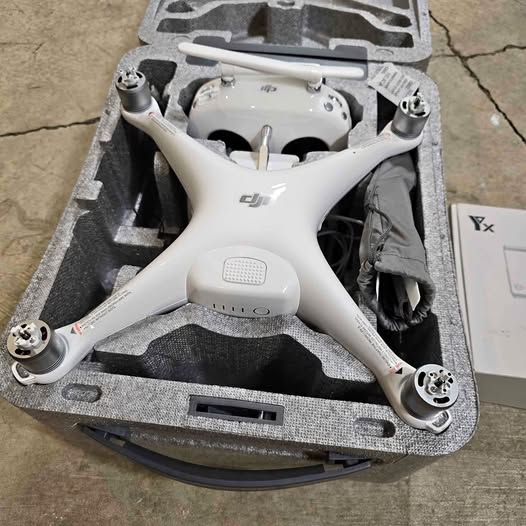 DJI Phantom 4 Pro drone in white with four propellers and protective case