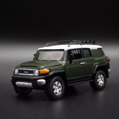 Green 1/64 diecast SUV model car with front bumper and headlights