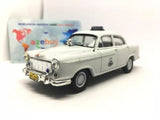 1956 police sedan diecast model car, light gray with front grille and headlights