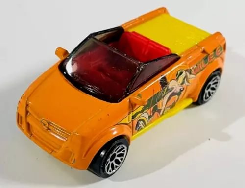 Orange convertible diecast car with open top, black windshield, detailed side graphics.