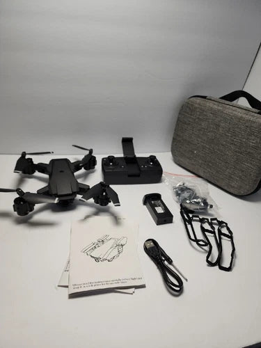 Drone with remote controller and accessories, plus carrying case and user manual