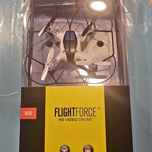 Brookstone Flightforce HD video drone in retail box, white quadcopter with propellers