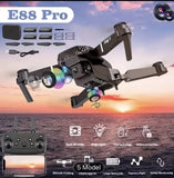 Black quadcopter drone with foldable arms and front camera, with remote controller