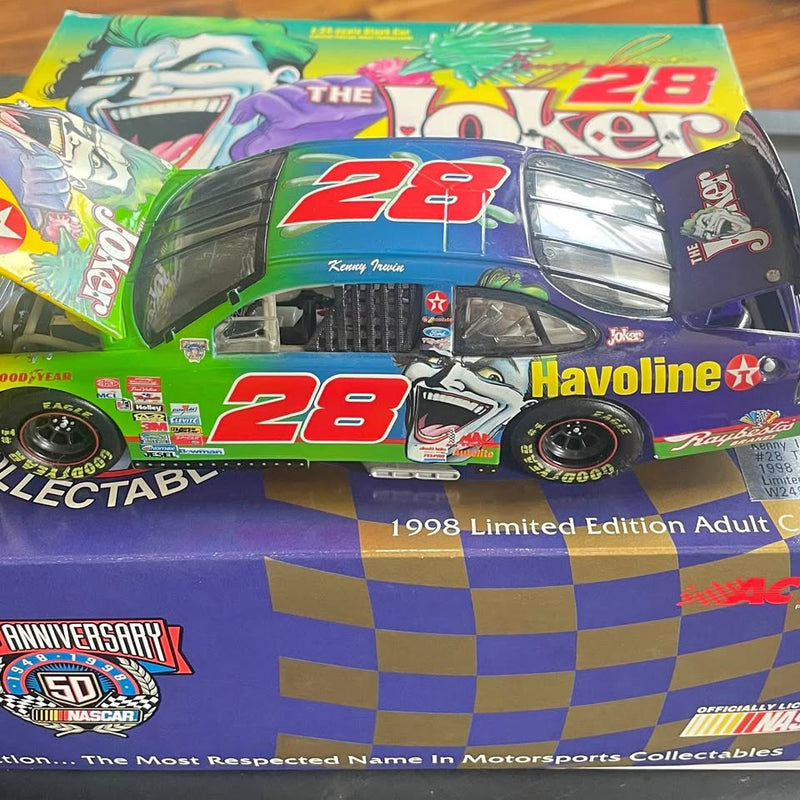 NASCAR diecast race car with #28, green and purple livery in retail box