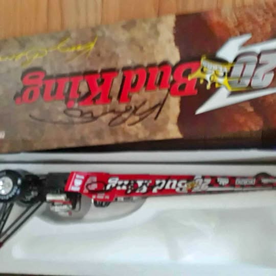 Red and white diecast car with printed graphics and side decals