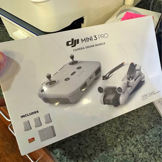 DJI Mini 3 Pro drone bundle box with white drone and controller, accessories shown