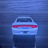 1/24 scale diecast police sedan model, rear view with POLICE badge