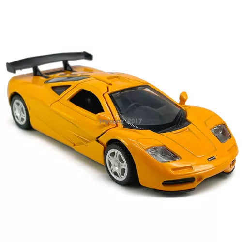 Orange diecast 1994 McLaren F1 model car with rear wing, 1:36 scale