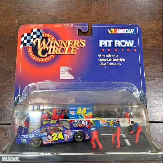 Blue #24 Jeff Gordon diecast car with pit crew figures in NASCAR Pit Row package